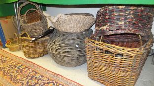 Fourteen various baskets and a saddle rack