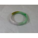 A jade bangle CONDITION REPORTS Overall with some general wear and scuffs, internal diameter of