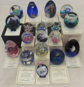 A collection of 18 various Caithness Collector's Club glass paperweights,