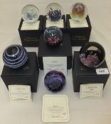 A collection of seven Caithness glass paperweights - "Atlantis", No'd. 783/1500, "Fest", No'd.