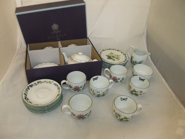 A P & O Cruises "Aurora 2012 World Circumnavigation" teapot and two matching cups and saucers,