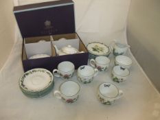 A P & O Cruises "Aurora 2012 World Circumnavigation" teapot and two matching cups and saucers,