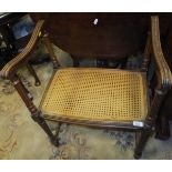 A circa 1900 French carved beech framed and caned stool in the Louis XVI taste