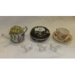 A miniature Chinese porcelain teapot, a miniature Continental porcelain cup and saucer,