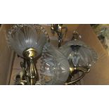 Four brassed bodied single branch wall lights with glass shades