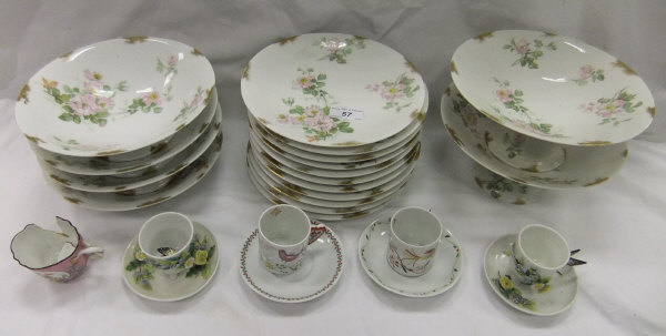 A Limoges porcelain dessert service decorated with pale pink roses, inscribed to base "D & C",