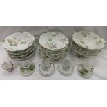 A Limoges porcelain dessert service decorated with pale pink roses, inscribed to base "D & C",