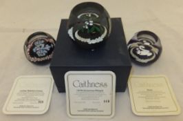 A collection of three Caithness glass paperweights - "1978 Christmas Paperweight", No'd. 449/500, "