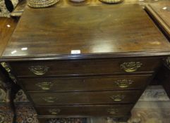 A 19th Century mahogany chest of four long graduated drawers with brass swan neck handles,