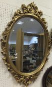 A gilt framed oval wall mirror with bevel edged plate CONDITION REPORTS Please not that this appears