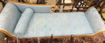 A Scandinavian Regency style chaise longue with blue upholstered seat and back