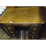 An 18th Century oak kneehole desk,