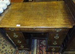 An 18th Century oak kneehole desk,