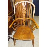 An early 20th Century beech and elm Thames Valley Windsor wheel and stick back armchair, bearing