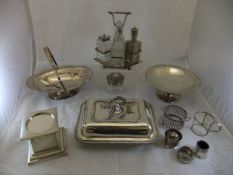 A collection of plated wares to include bottle holders, cruet stand, plinth base, entrée dish, etc.