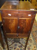 A Georgian mahogany square wash stand, the two section top opening to reveal toiletry holes,