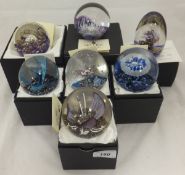 A collection of seven Selkirk Glass paperweights - "Golden Orchid", No'd.