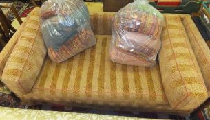 A Colfax and Fowler red and brown upholstered two seater settee,