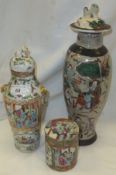 A late 19th / early 20th Century Chinese famille rose vase and cover with lion mask handles,