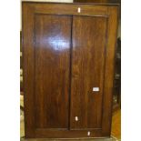 An oak wall hanging corner cabinet,