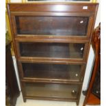 An oak four section Globe Wernicke style book case