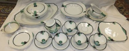 A collection of Shelley "Vogue" art deco tea cups and saucers, tea plates, cake plate and milk jug
