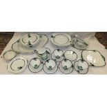 A collection of Shelley "Vogue" art deco tea cups and saucers, tea plates, cake plate and milk jug