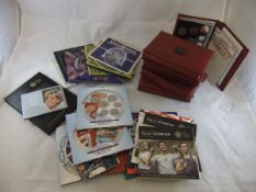 A box containing assorted coin proof sets dating from the mid 1970's onwards