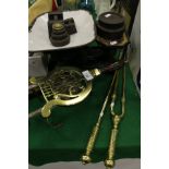 A 19th Century brass trivet/warmer of lyre form with turned wooden handle,