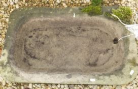 A natural stone shallow trough