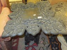 A 19th Century Indian folding table carved with flowers CONDITION REPORTS Top has various chips