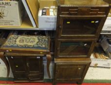 An oak cabinet, the two doors opening to reveal various pigeon holes etc, over two further door,