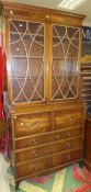 A mahogany secretaire bookcase with two glazed doors over three long drawers CONDITION REPORTS