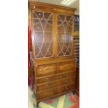 A mahogany secretaire bookcase with two glazed doors over three long drawers CONDITION REPORTS