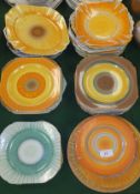 A large collection of Shelley pottery plates with dripware and concentric circle decoration, etc (