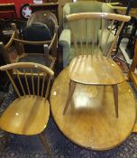 A Victorian mahognay oval loo table on quadruped base (cut down), a 20th Century wing back armchair,