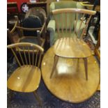 A Victorian mahognay oval loo table on quadruped base (cut down), a 20th Century wing back armchair,