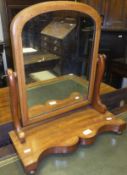 A Victorian mahogany framed dressing mirror on platform base to bun feet