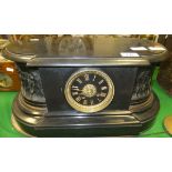 A Victorian bronze and slate cased mantel clock formed as a plinth with eight day movement