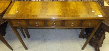 A rectangular hall table with five short drawers,