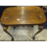 A Victorian oak card table, the rectangular top with counter dished corners and trumps carvings,