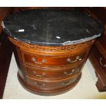 A pair of Universal Furniture commodes of oval form in the George III taste, the black marble top