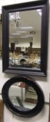 A modern rectangular black framed wall mirror,
