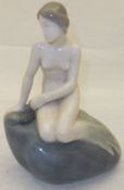 A Royal Copenhagen figure of a mermaid seated upon a rock,  model 4431 CONDITION REPORTS