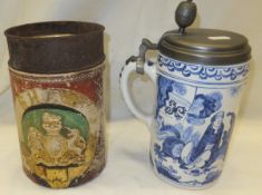 A 19th Century glazed tobacco jar with relief decorated Coat of Arms painted in iron red,