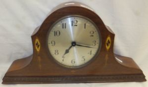 A mahogany and inlaid cased dome top mantel clock,