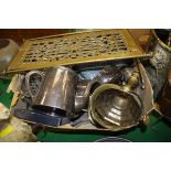 A brass pestle and mortar, large brass trivet on X framed base, brass candlestick, etc.
