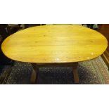 A modern pine oval dining table