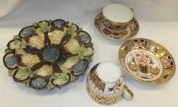 A pair of 19th Century Spode cups and saucers decorated in the Imari taste, a pair of studio pottery