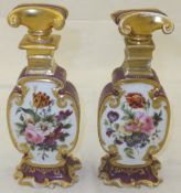 A pair of French porcelain dressing table scent bottles, each painted with a lady in 18th Century